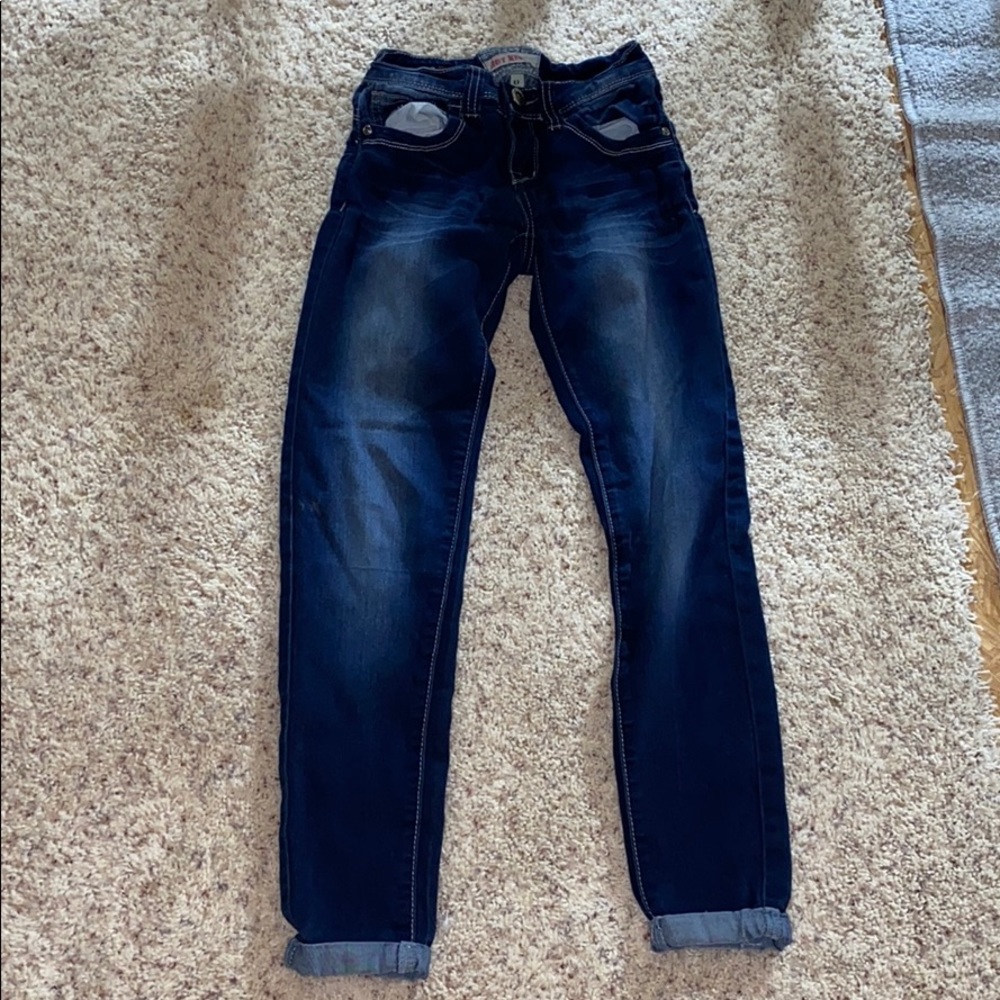 This is a pair of stretchy distressed denim jeans.